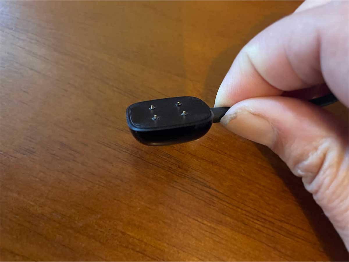 Seeing a message that your Fitbit is charging slowly? Learn what to do