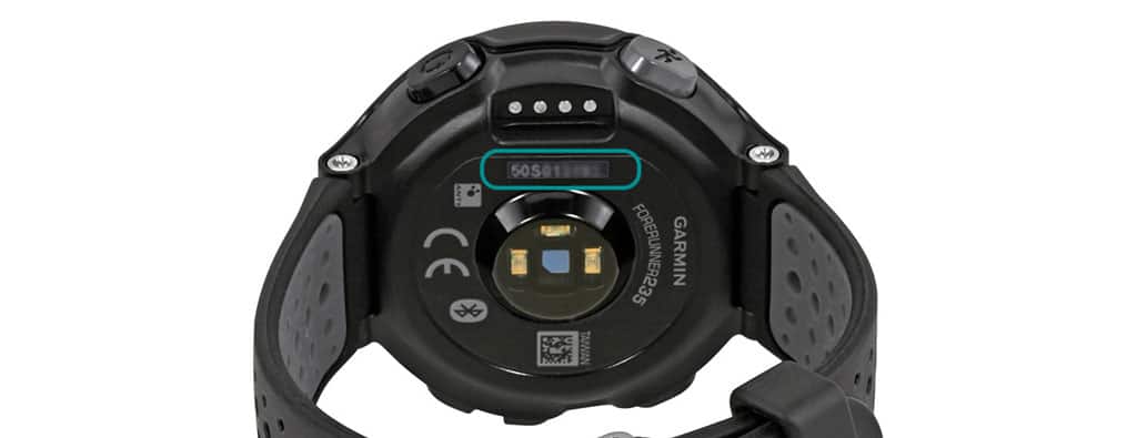 Garmin serial number printed on the back of smartwatch