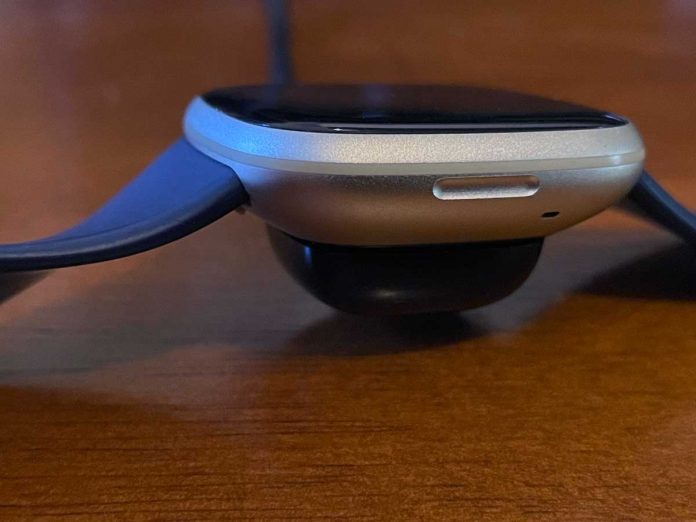 Seeing a message that your Fitbit is charging slowly? Learn what to do