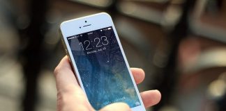 holding iPhone screen